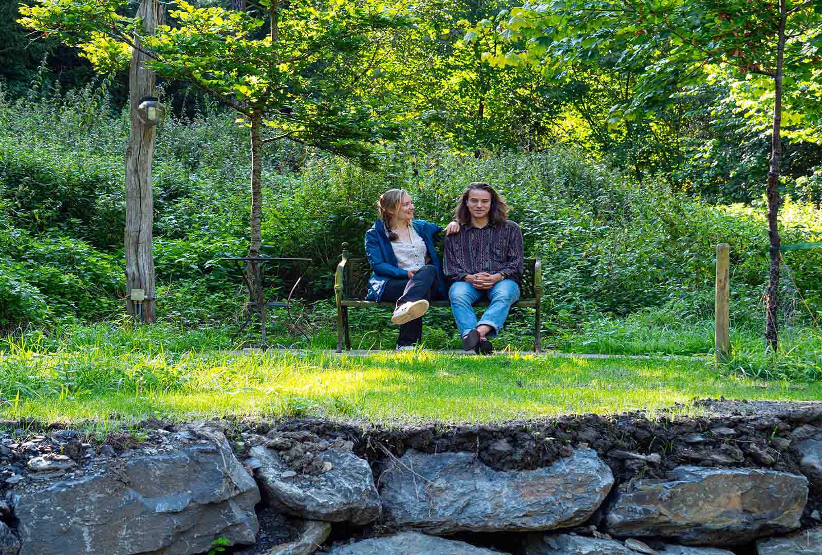 Couple by the stream in the valley